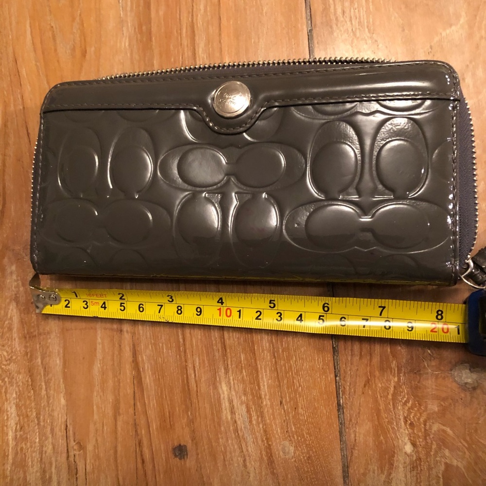 Patent leather grey Coach wallet.